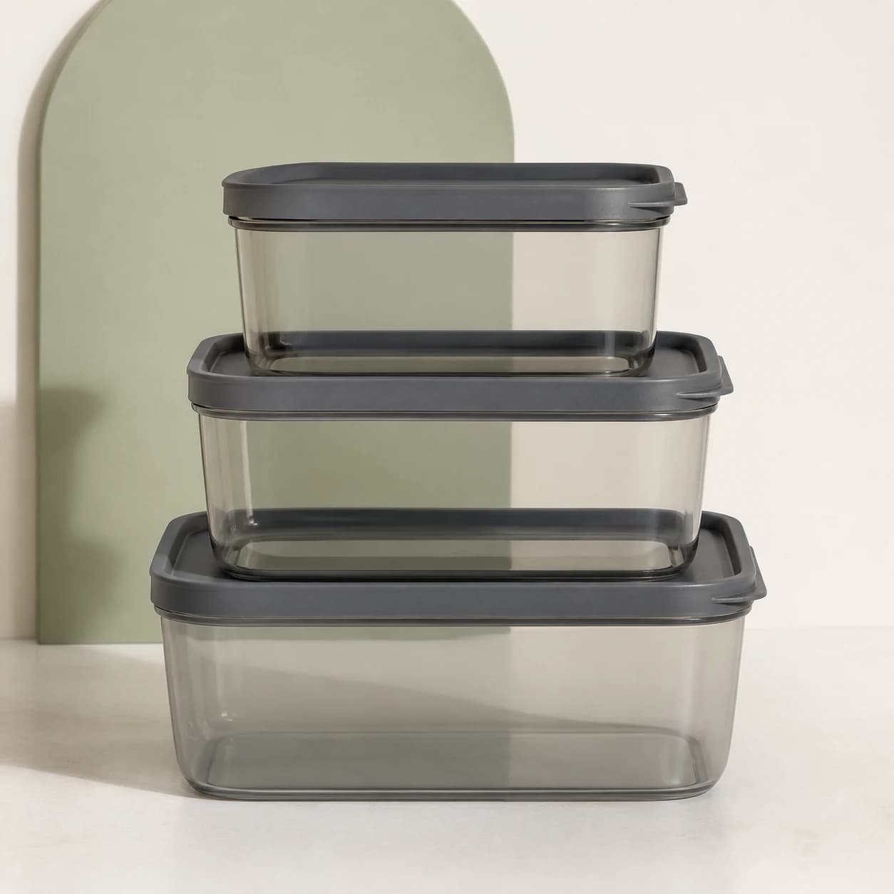 Three translucent smoke pantry containers with charcoal lids